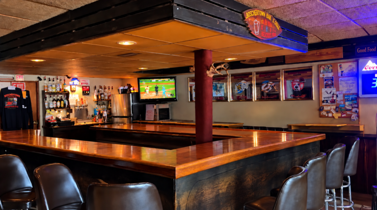 The main wooden bar inside Boschertown Bar & Grill