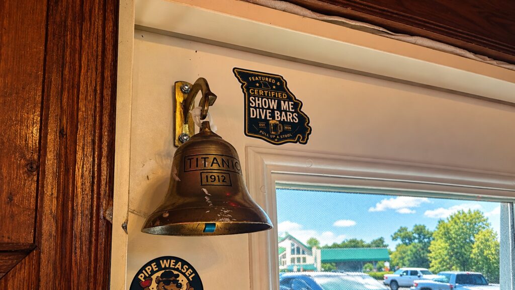 SMDB Certified sticker beside the Titanic 1912 bell at The Glory Hole