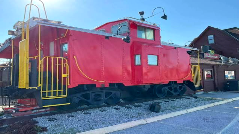 The red caboose behind Trainwreck Saloon in Rock Hill